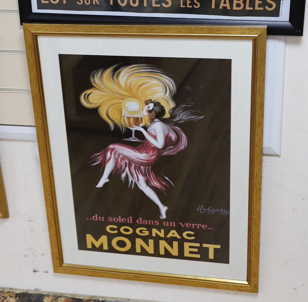 Two framed colour-printed French advertising posters - Le Dauré and Cognac Monnet. Largest 60x89cm